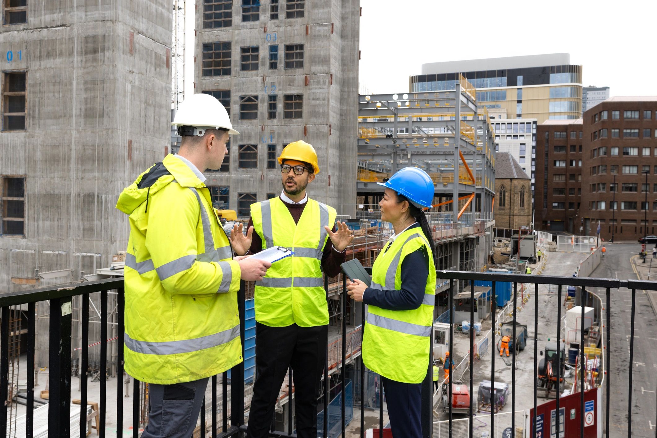 Engineering professionals reviewing plans at an infrastructure site