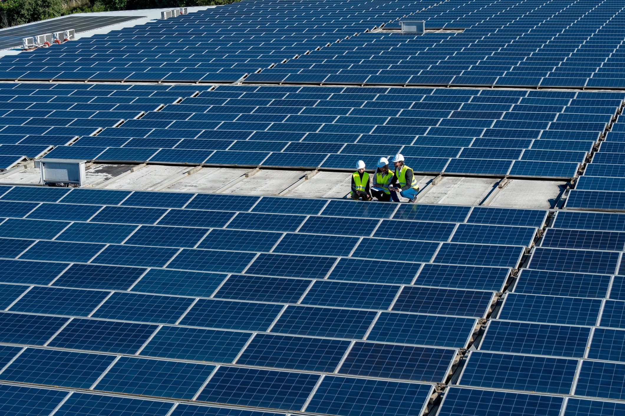 Engineers reviewing plans on a solar installation